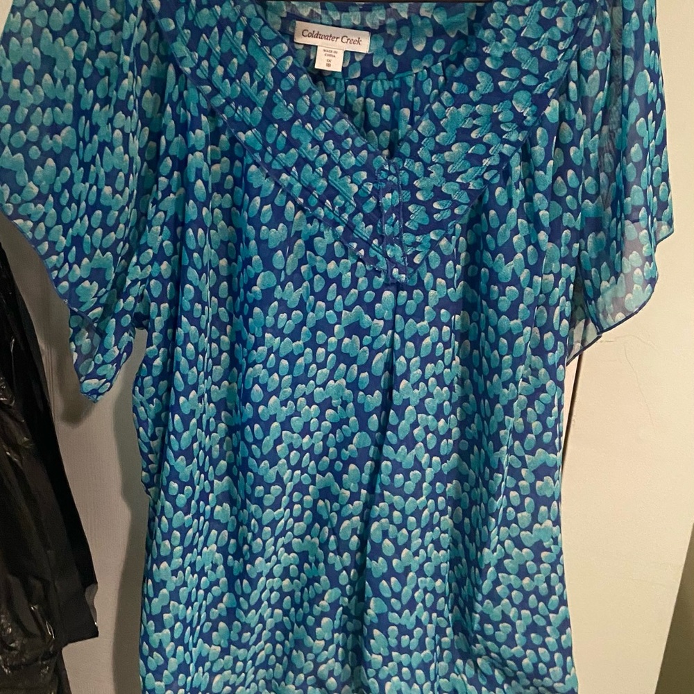 Green and blue and white colorful flowing shirt